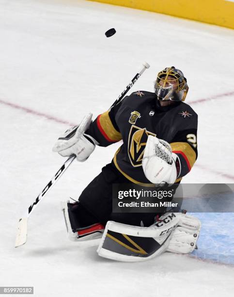 Marc-Andre Fleury of the Vegas Golden Knights deflects an Arizona Coyotes shot during the first period of the Golden Knights' inaugural...