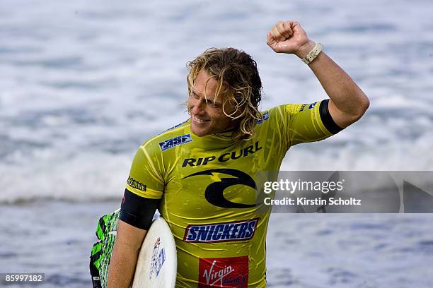 Local wildcard surfer Adam Robertson of Australia claims his victory as the local crowd cheers after winning his Round 3 heat to advance into the...