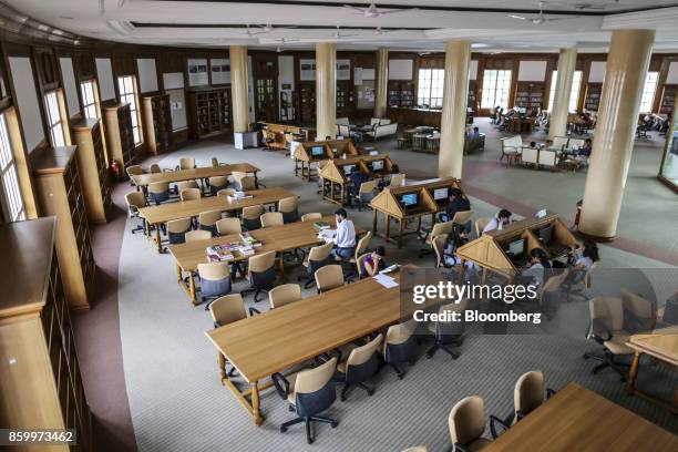 People study in a library at the Infosys Ltd. Global Education Centre campus in Mysore, India, on Tuesday, Aug. 22, 2017. The facility sitting on 337...