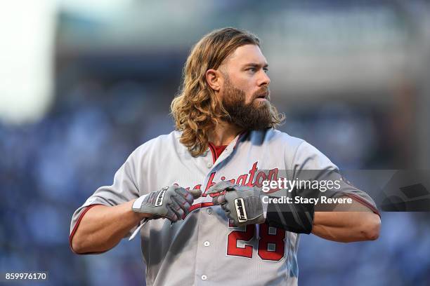 Jayson Werth of the Washington Nationals removes his batting gloves during game three of the National League Divisional Series against the Chicago...