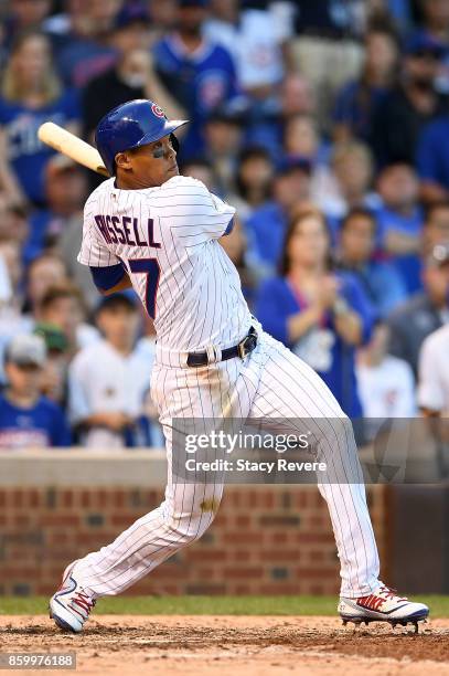 Addison Russell of the Chicago Cubs at bat against the Washington Nationals during game three of the National League Divisional Series at Wrigley...