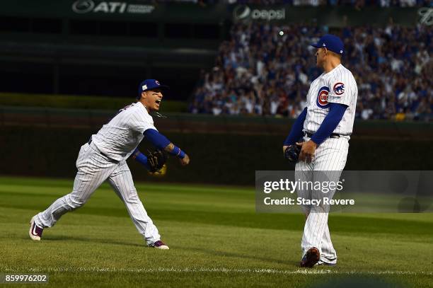 Javier Baez of the Chicago Cubs reacts after Anthony Rizzo makes the final out against the Washington Nationals during game three of the National...