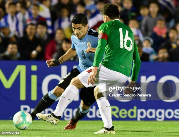 Luis Suarez of Uruguay fights for the ball with Ronald Raldes of Bolivia during a match between Uruguay and Bolivia as part of FIFA 2018 World Cup...