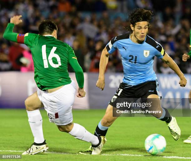 Edinson Cavani of Uruguay tries to dribble Ronald Raldes of Bolivia during a match between Uruguay and Bolivia as part of FIFA 2018 World Cup...