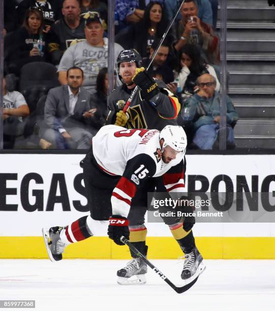 James Neal of the Vegas Golden Knights checks Brad Richardson of the Arizona Coyotes during the second period during the Golden Knights' inaugural...