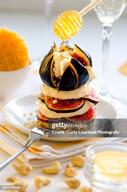 french artisanal goat cheese crottin de chavignol made in ukraine, sliced with figs, honey, cashew, waffles and white dry wine - chavignol stock pictures, royalty-free photos & images