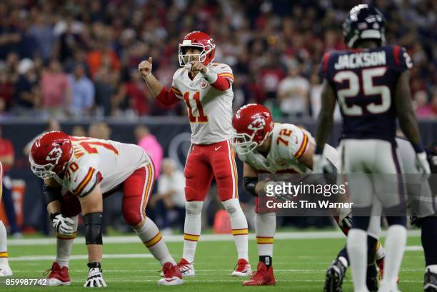 Alex Smith of the Kansas City Chiefs signals at the line of scrimmage in the second half against the Houston Texans at NRG Stadium on October 8, 2017...