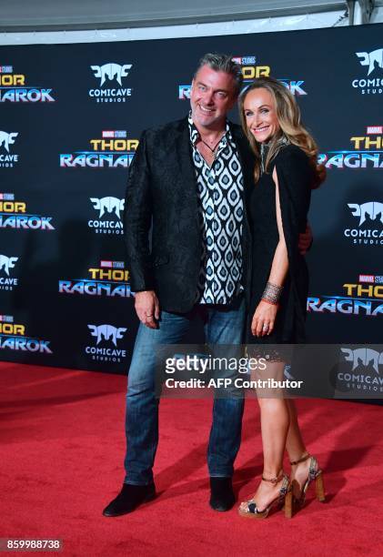 Actor Ray Stevenson and Elisabetta Caraccia arrive for the premiere of the film "Thor: Ragnarok" in Hollywood, California on October 10, 2017. / AFP...