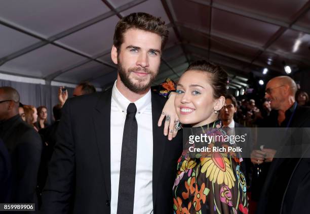 Actor Liam Hemsworth and Miley Cyrus at The World Premiere of Marvel Studios' "Thor: Ragnarok" at the El Capitan Theatre on October 10, 2017 in...