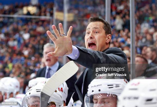 Head coach Guy Boucher of the Ottawa Senators yells from bench during their NHL game against the Vancouver Canucks at Rogers Arena October 10, 2017...