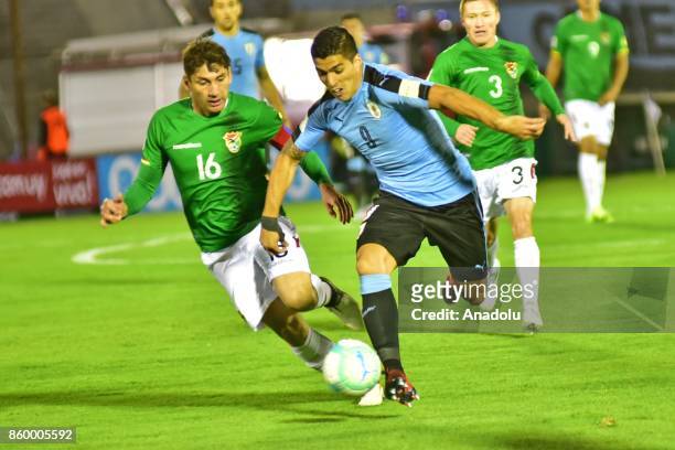 Ronald Raldes and Luis Suarez vie for the ball during the 2018 FIFA World Cup Qualification match between Uruguay and Bolivia at Centenario Stadium...