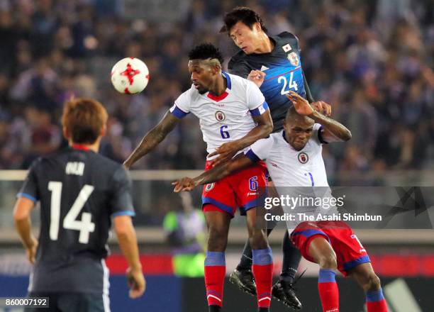 Shintaro Kurumaya of Japan heads the ball during the international friendly match between Japan and Haiti at Nissan Stadium on October 10, 2017 in...