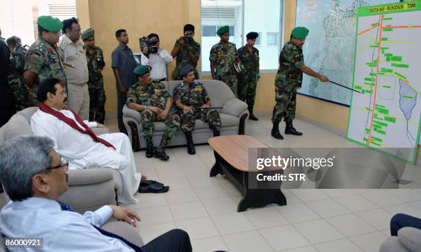 Sri Lankan Army Major General Jagath Dias points to a map where security forces are located during a presentation for Sri Lankan President Mahinda...
