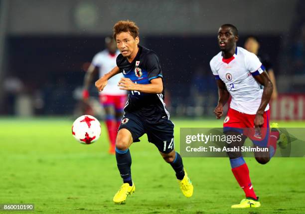 Takashi Inui of Japan in action during the international friendly match between Japan and Haiti at Nissan Stadium on October 10, 2017 in Yokohama,...