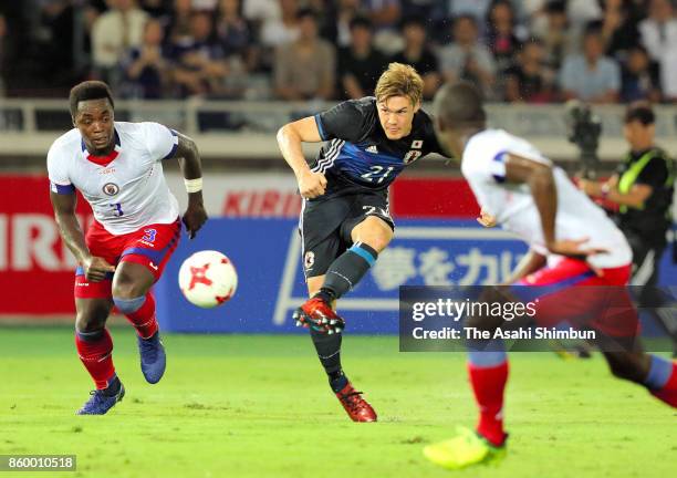 Gotoku Sakai of Japan shoots at goal during the international friendly match between Japan and Haiti at Nissan Stadium on October 10, 2017 in...