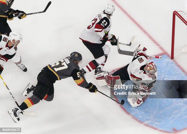 David Perron of the Vegas Golden Knights misses an attempt against Antti Raanta of the Arizona Coyotes during the first period during the Golden...