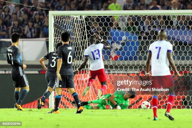 Kevin Pierre Lafrance of Haiti scores his side's first goal past Masaaki Higashiguchi of Japan during the international friendly match between Japan...