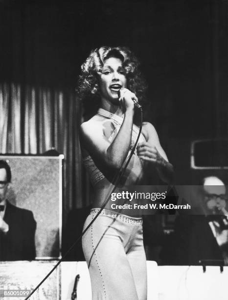 American actress and singer Marilyn Chambers sings on stage, New York, New York, March 7, 1974.