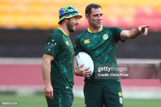 Ben Hunt and Cameron Smith talk during an Australian Kangaroos Rugby League World Cup training session at Suncorp Stadium on October 11, 2017 in...