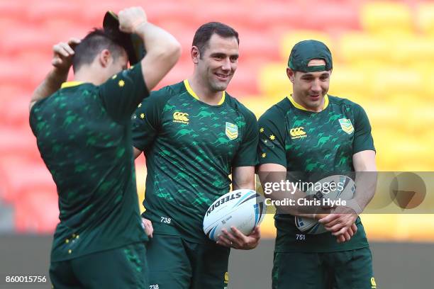 Cameron Smith and Billy Slater talk during an Australian Kangaroos Rugby League World Cup training session at Suncorp Stadium on October 11, 2017 in...