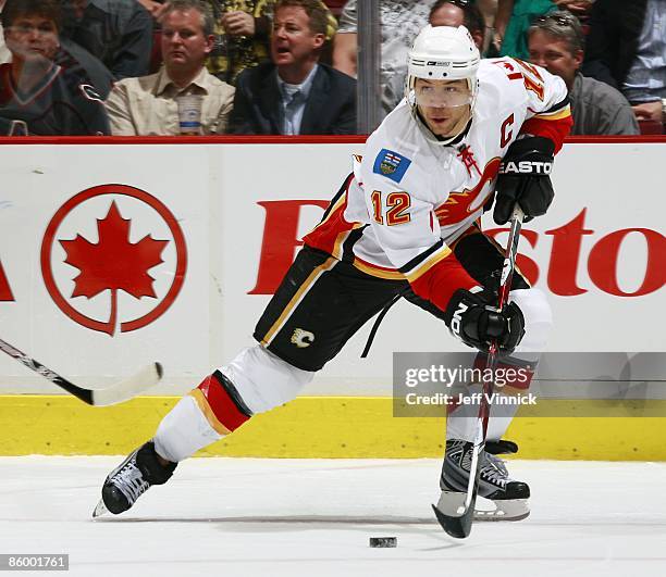 Jarome Iginla of the Calgary Flames skates up ice with the puck during the game against the Vancouver Canucks at General Motors Place on April 7,...