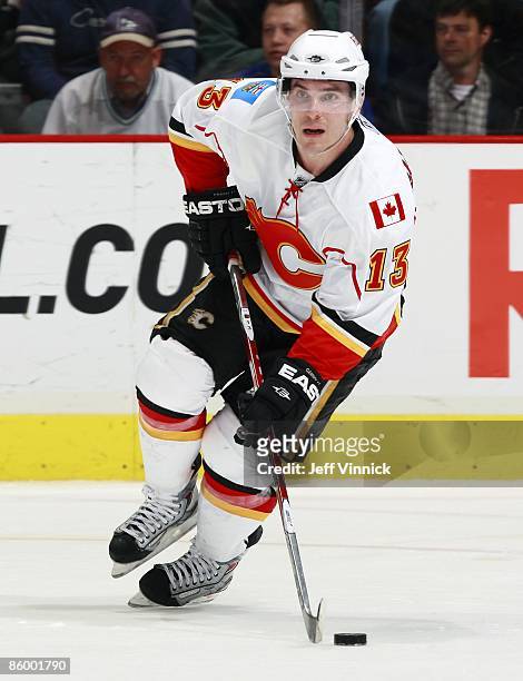 Mike Cammalleri of the Calgary Flames skates up ice with the puck during the game against the Vancouver Canucks at General Motors Place on April 7,...