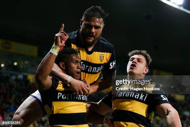 Waisake Naholo of Taranaki celebrates with Ricky Riccitelli and Angus Ta'avao after scoring a try during the round nine Mitre 10 Cup and Ranfurly...