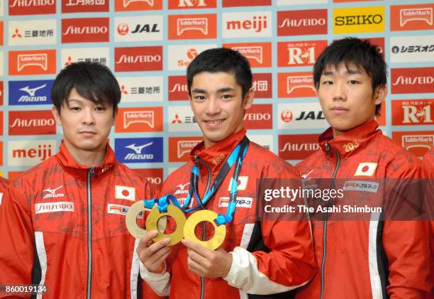 Kohei Uchimura , Kenzo Shirai and Hidetaka Miyachi attend a press conference on arrival at Narita International Airport on October 10, 2017 in...