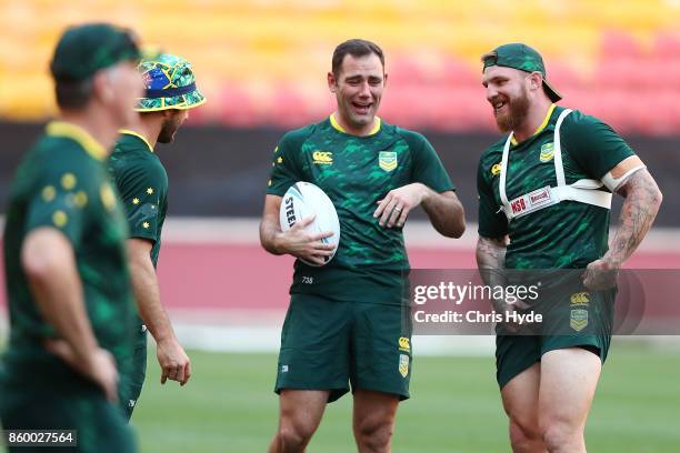 Cameron Smith and Josh McGuire laugh during an Australian Kangaroos Rugby League World Cup training session at Suncorp Stadium on October 11, 2017 in...