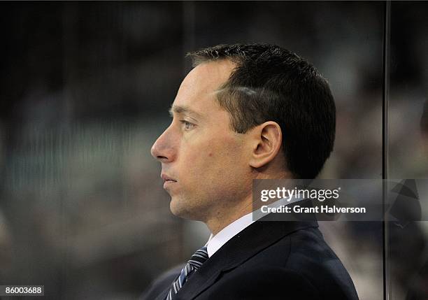 Assistant Coach Greg Carvel of the Ottawa Senators looks on from the bench area dduring the NHL game against the Carolina Hurricanes at the RBC...