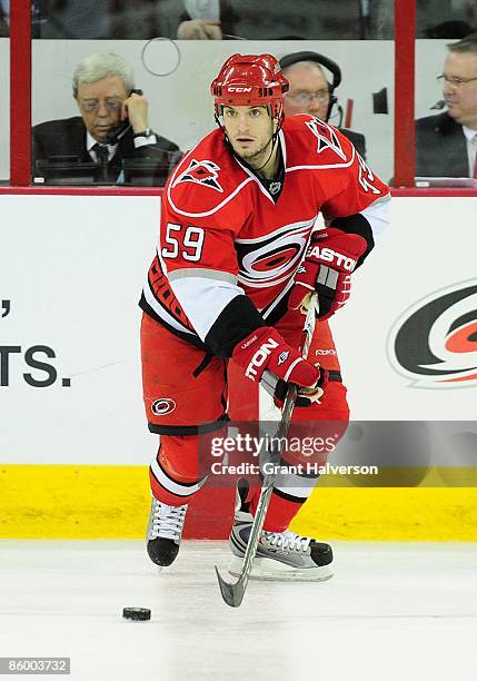 Chad LaRose of the Carolina Hurricanes controls the puck during the NHL game against the Ottawa Senators at the RBC Center on March 25, 2009 in...