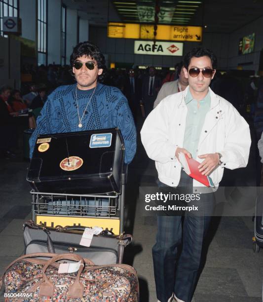 Argentina footballers Diego Maradona is met by his friend and international teammate Osvaldo Ardiles on his arrival at London Heathrow, Maradona is...