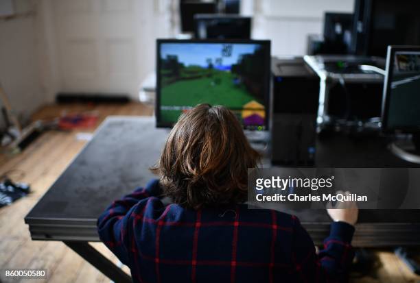 Minecraft digital artist hard at work backstage during a 'Playcraft' live rehearsal at The Playhouse Theatre and Arts Centre on October 10, 2017 in...