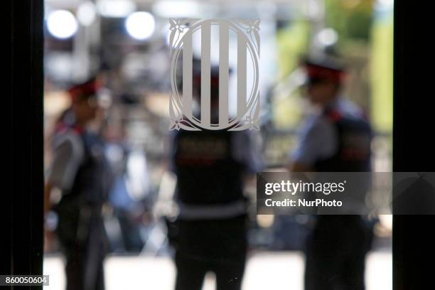 Catalonia's police block the acces to Catalonia's Parliament. Carles Puigdemont, president of the Catalan government, declares the republic and...