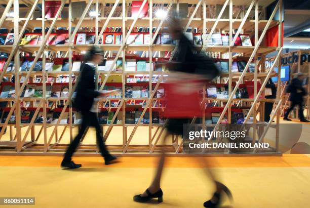 Visitors walk in the pavillon of guest of honor France at the Frankfurt Book Fair 2017 in Frankfurt am Main, western Germany, on October 11, 2017....