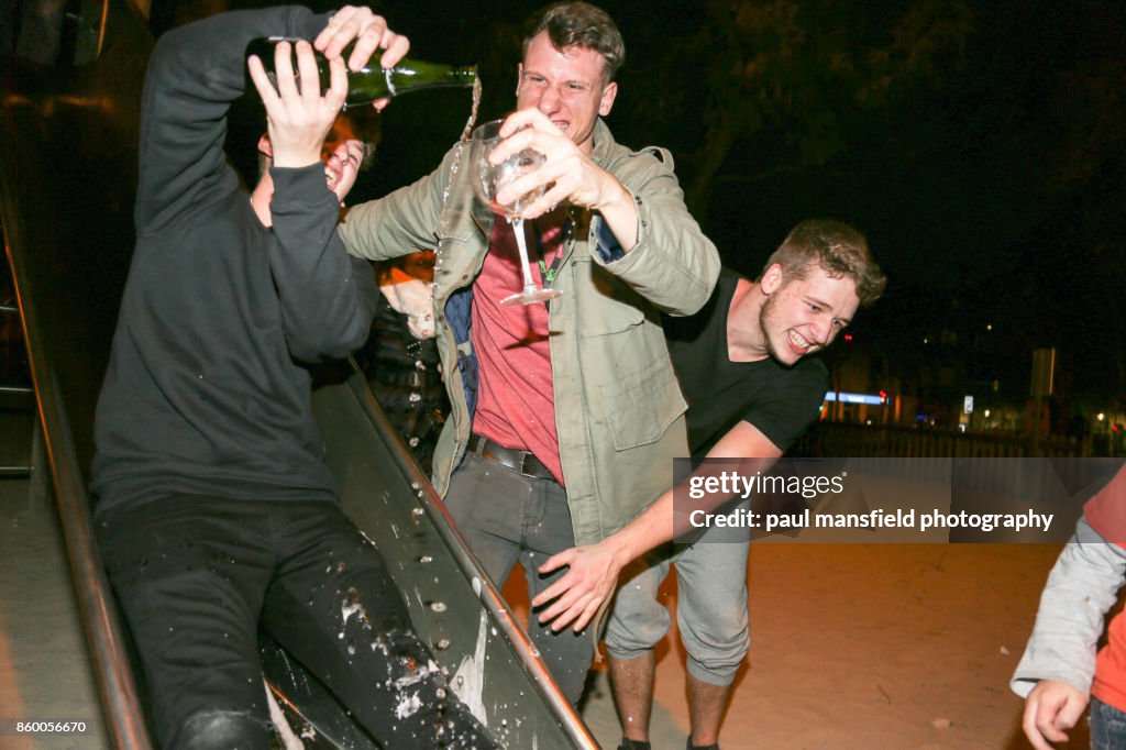 Friends celebrating New Years Eve at playground