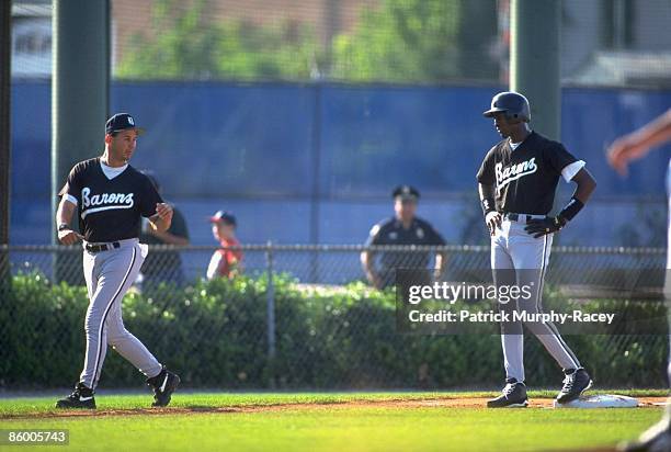 Minor League Baseball: Birmingham Barons Michael Jordan on 3rd base with manager Terry Francona during game at Hoover Metropolitan Stadium. Class...