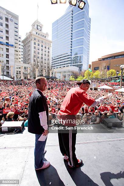 Brandon Roy of the playoff bound Portland Trail Blazers and Trail Blazer TV personality Mike Barrett join fans in celebration during a public playoff...