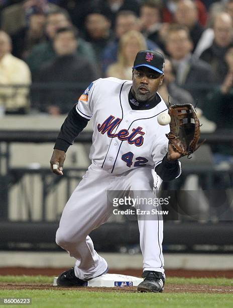 Carlos Delgado of the New York Mets catches a ball at first base during their game against the San Diego Padres on April 15, 2009 at Citi Field in...