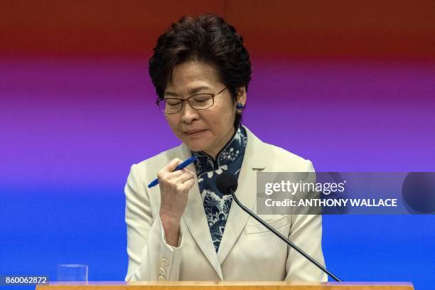 Hong Kong's Chief Executive Carrie Lam pauses while answering a question during a press conference after her first policy address at the Legislative...