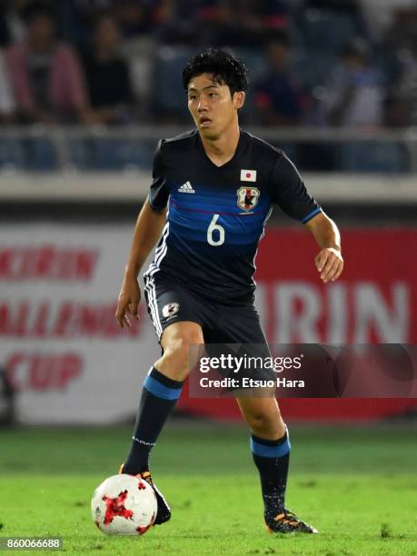 Wataru Endo of Japan in action during the international friendly match between Japan and Haiti at Nissan Stadium on October 10, 2017 in Yokohama,...