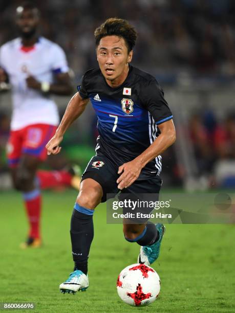 Shu Kurata of Japan in action during the international friendly match between Japan and Haiti at Nissan Stadium on October 10, 2017 in Yokohama,...