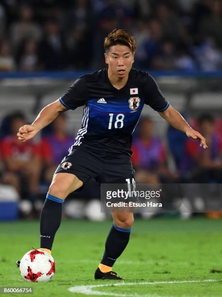 Takuma Asano of Japan in action during the international friendly match between Japan and Haiti at Nissan Stadium on October 10, 2017 in Yokohama,...
