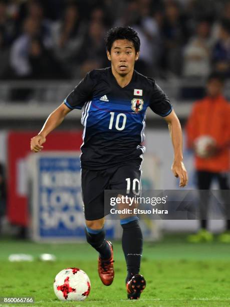 Shinji Kagawa of Japan in action during the international friendly match between Japan and Haiti at Nissan Stadium on October 10, 2017 in Yokohama,...