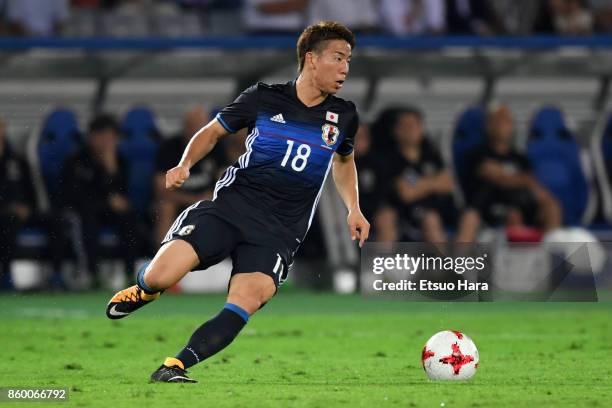 Takuma Asano of Japan in action during the international friendly match between Japan and Haiti at Nissan Stadium on October 10, 2017 in Yokohama,...