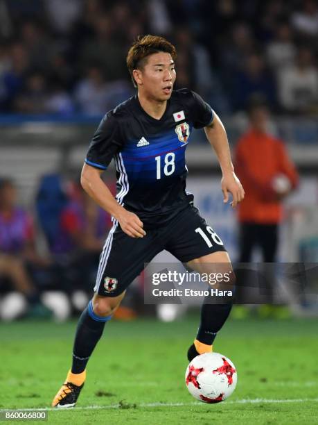 Takuma Asano of Japan in action during the international friendly match between Japan and Haiti at Nissan Stadium on October 10, 2017 in Yokohama,...