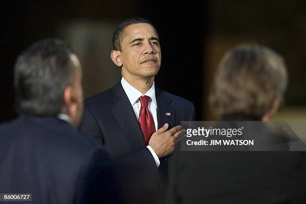 President Barack Obama stands for the US National Anthem during a reception and dinner at the Museo Nacional de Antropologia in Mexico City, Mexico,...