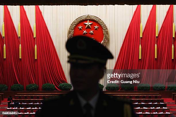 Chinese military band conductor is seen during a rehearsal before the closing session of the National People's Congress , or parliament, at the Great...