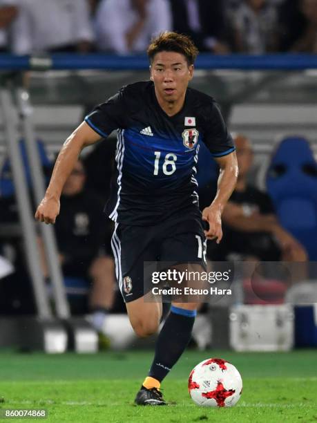 Takuma Asano of Japan in action during the international friendly match between Japan and Haiti at Nissan Stadium on October 10, 2017 in Yokohama,...