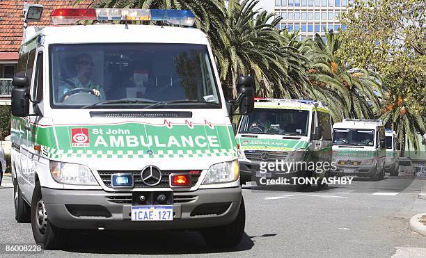 Afghan asylum seekers suffering burns arrive in an ambulance convoy at the emergency section of Royal Perth Hospital in Perth on April 17, 2009. 47...